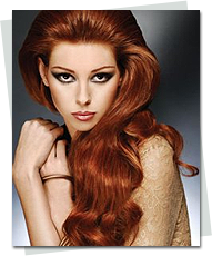 Woman with long red hair with extensions that is styled beautifully