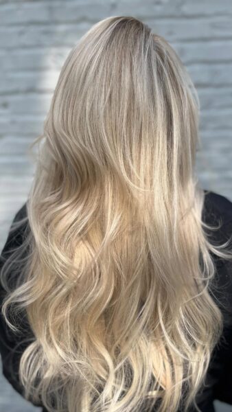 long icy blonde hair color and highlights with an extension fill