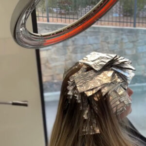 Infrared Hair Color Processor on her hair in foils.