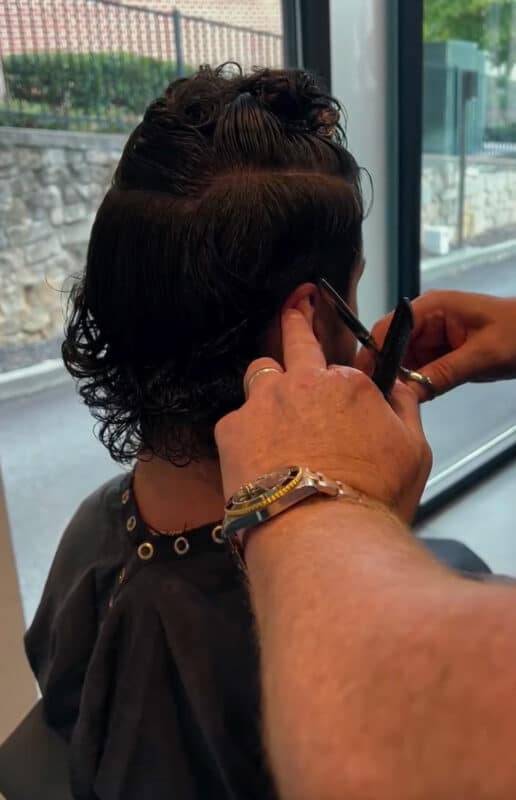 Client getting a haircut at BLS in Atlanta.