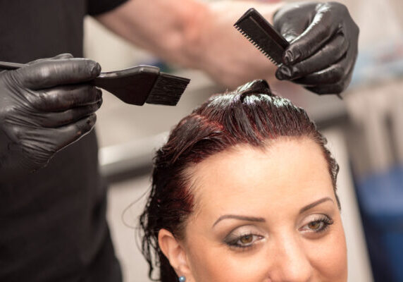 Hairdresser coloring hair